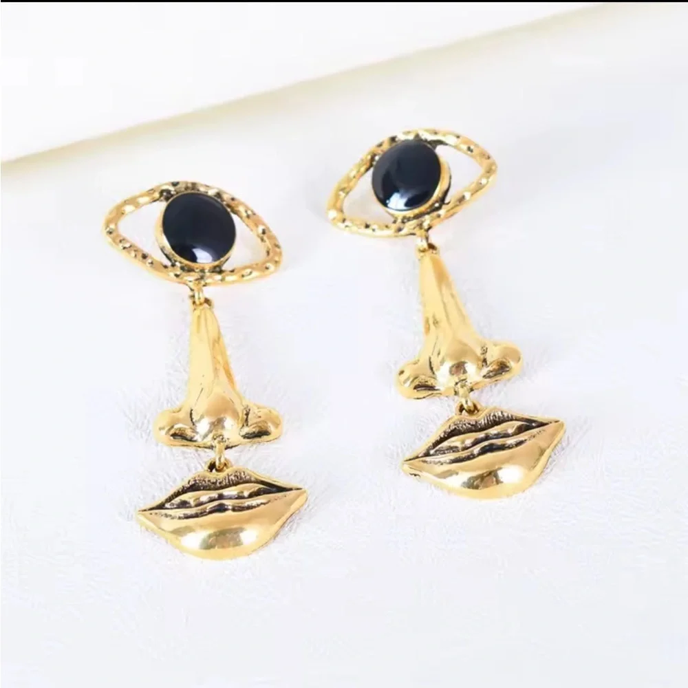 Gold and Black Eye Earrings Face